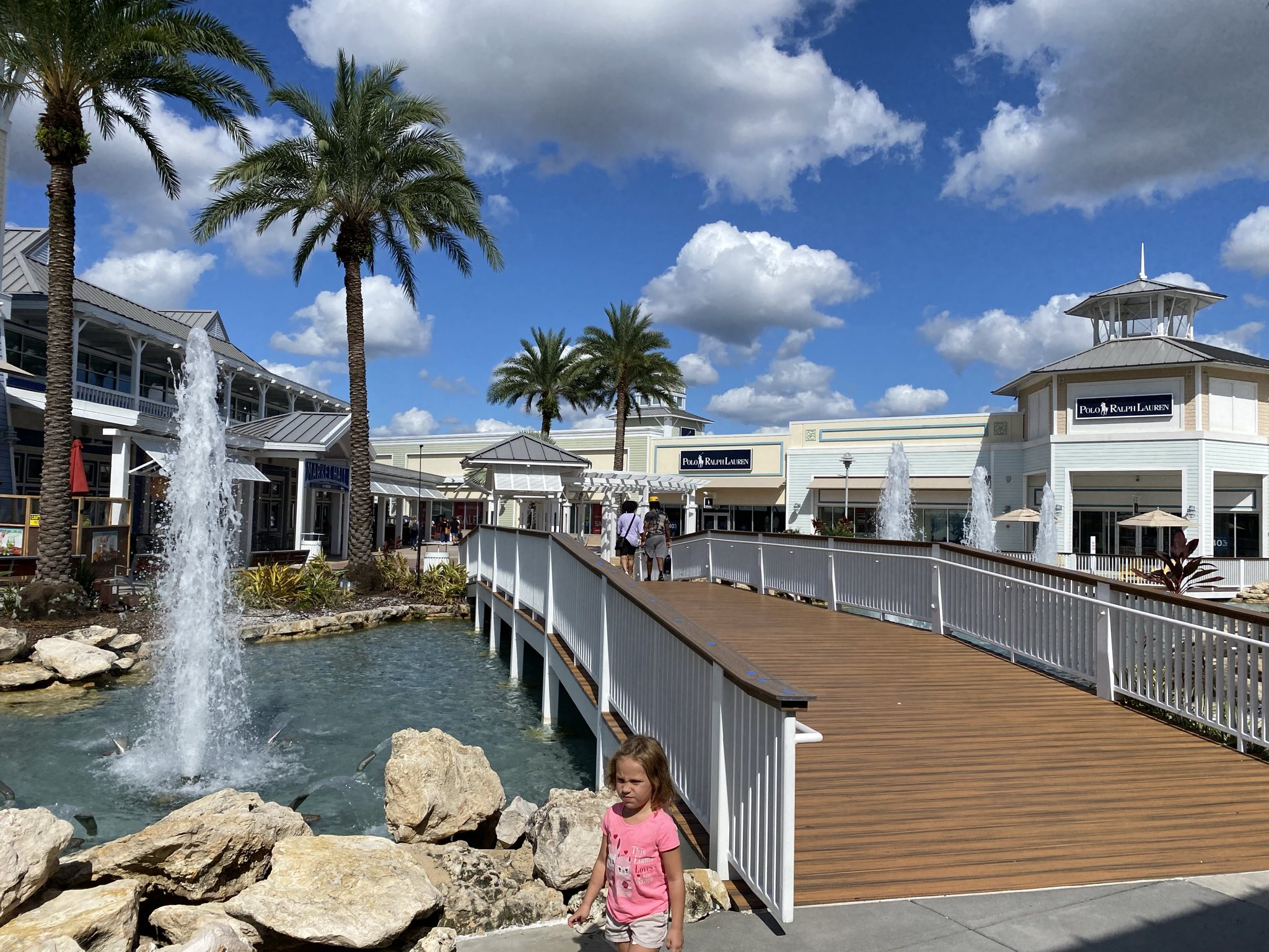 Lutz Florida Shopping Area and outdoor Mall showing a long white bridge and palm trees.