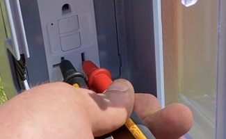 Reliant Electrical Testing and Inspections of exterior faulty wiring of a GFCI receptacle in Pasco County FL