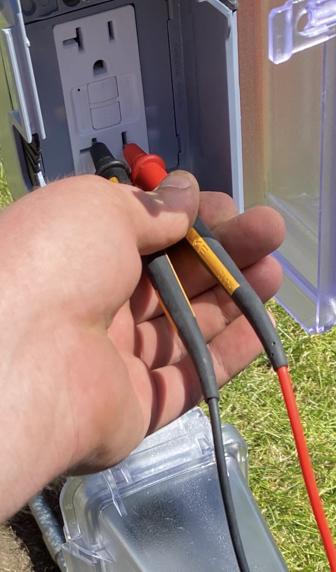 Reliant Electrical Testing and Inspections of exterior faulty wiring of a GFCI receptacle in Pasco County FL